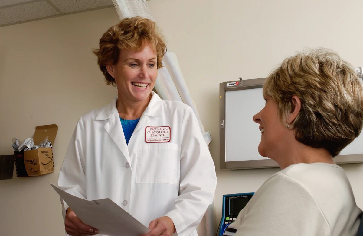 Smiling doctor reviewing a care plan with a patient
