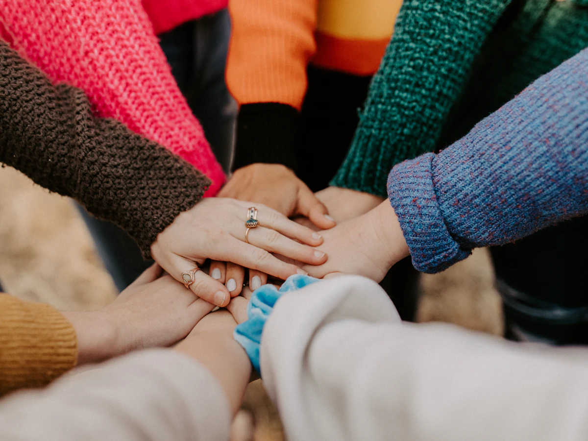 Hands stacked together in unity