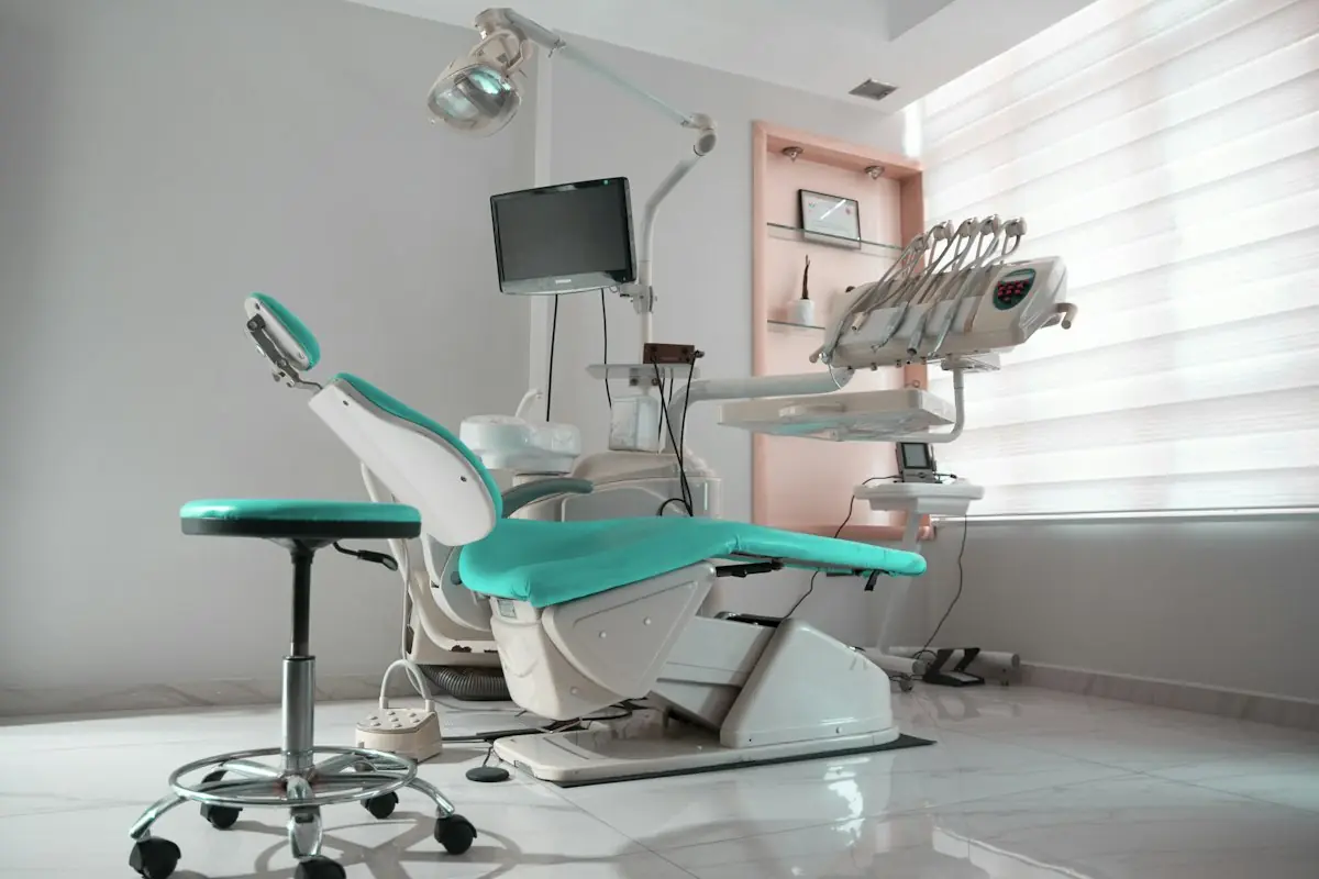 A treatment chair beside a sunlit window