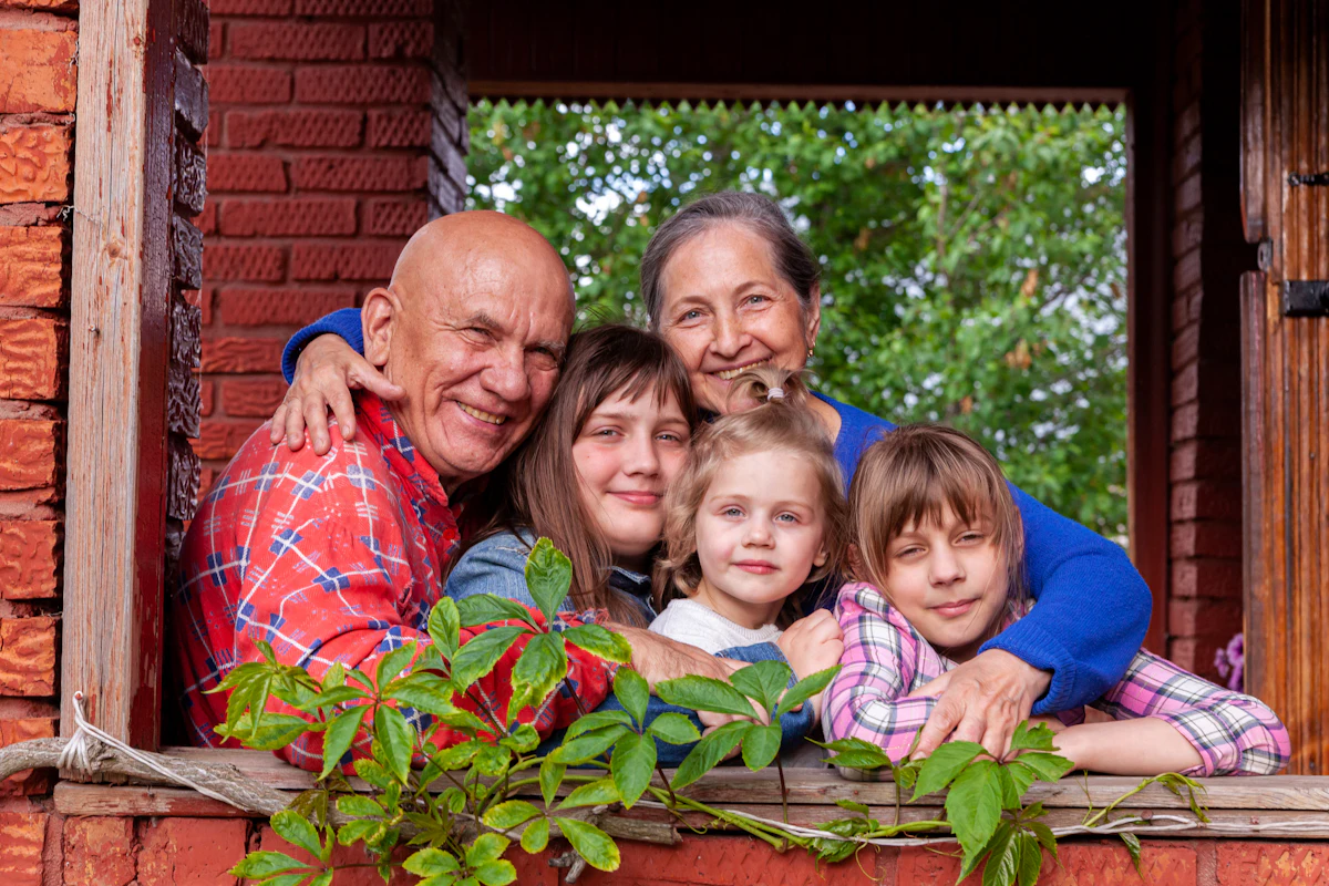 Three generations of a family smiling together