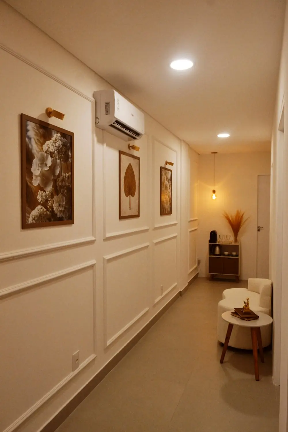 A quiet hallway in the clinic with framed botanical prints