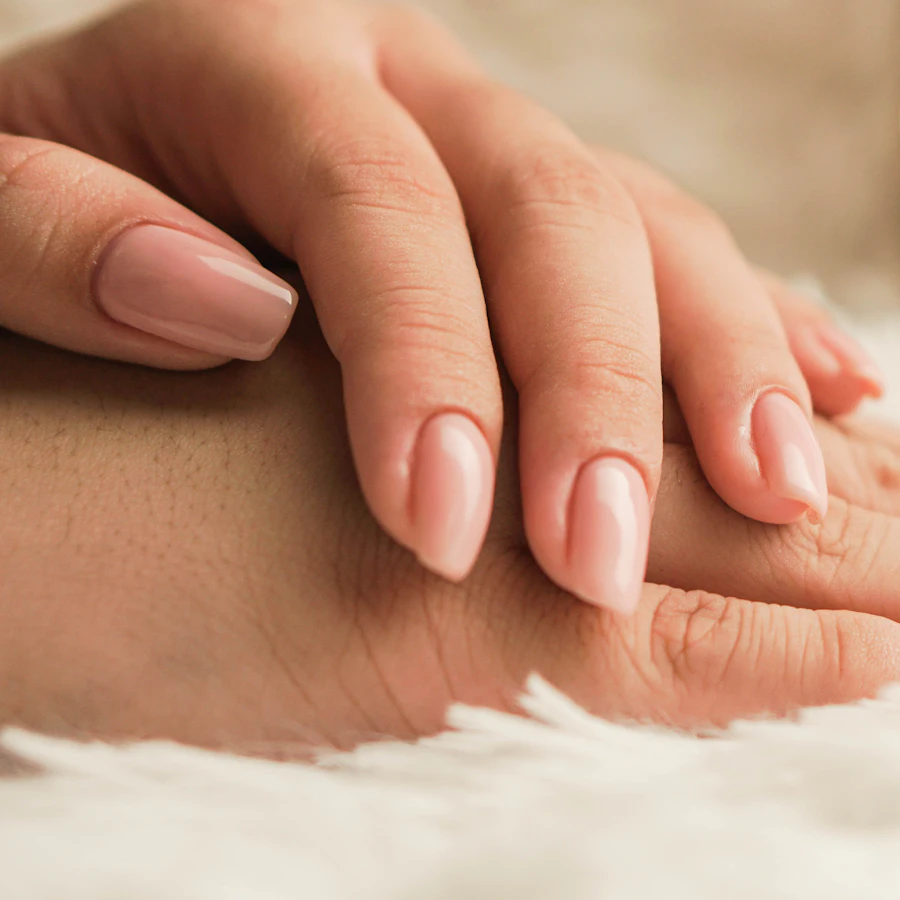 Natural nude manicure on soft fur
