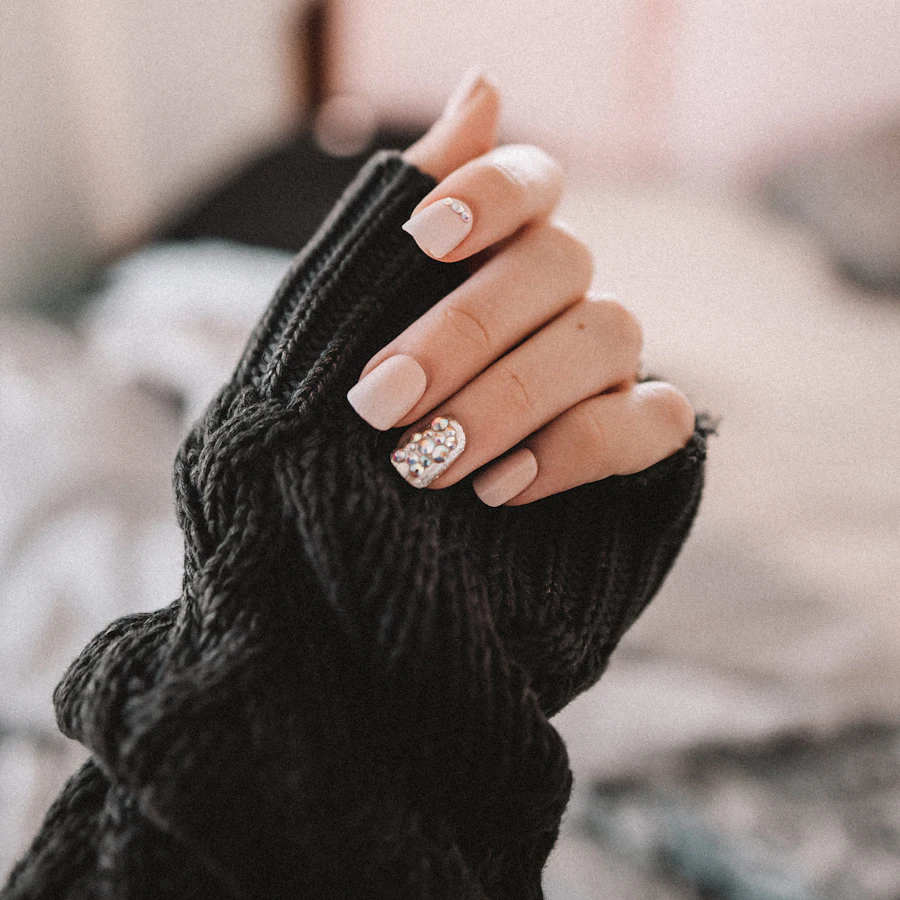 Soft pink oval nails against a blush backdrop