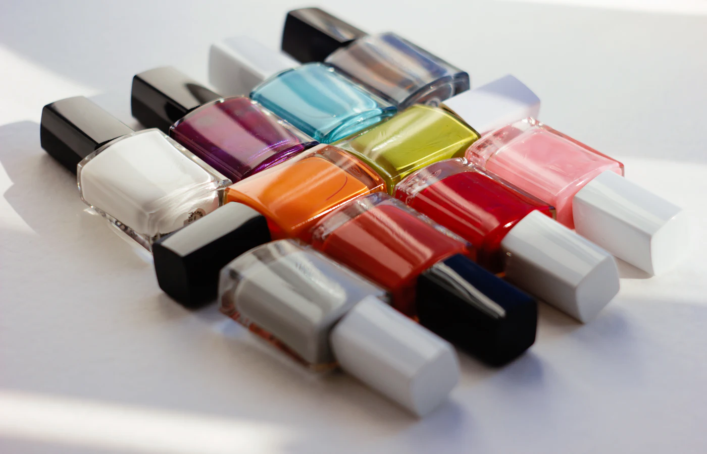 A row of colorful gel polish bottles