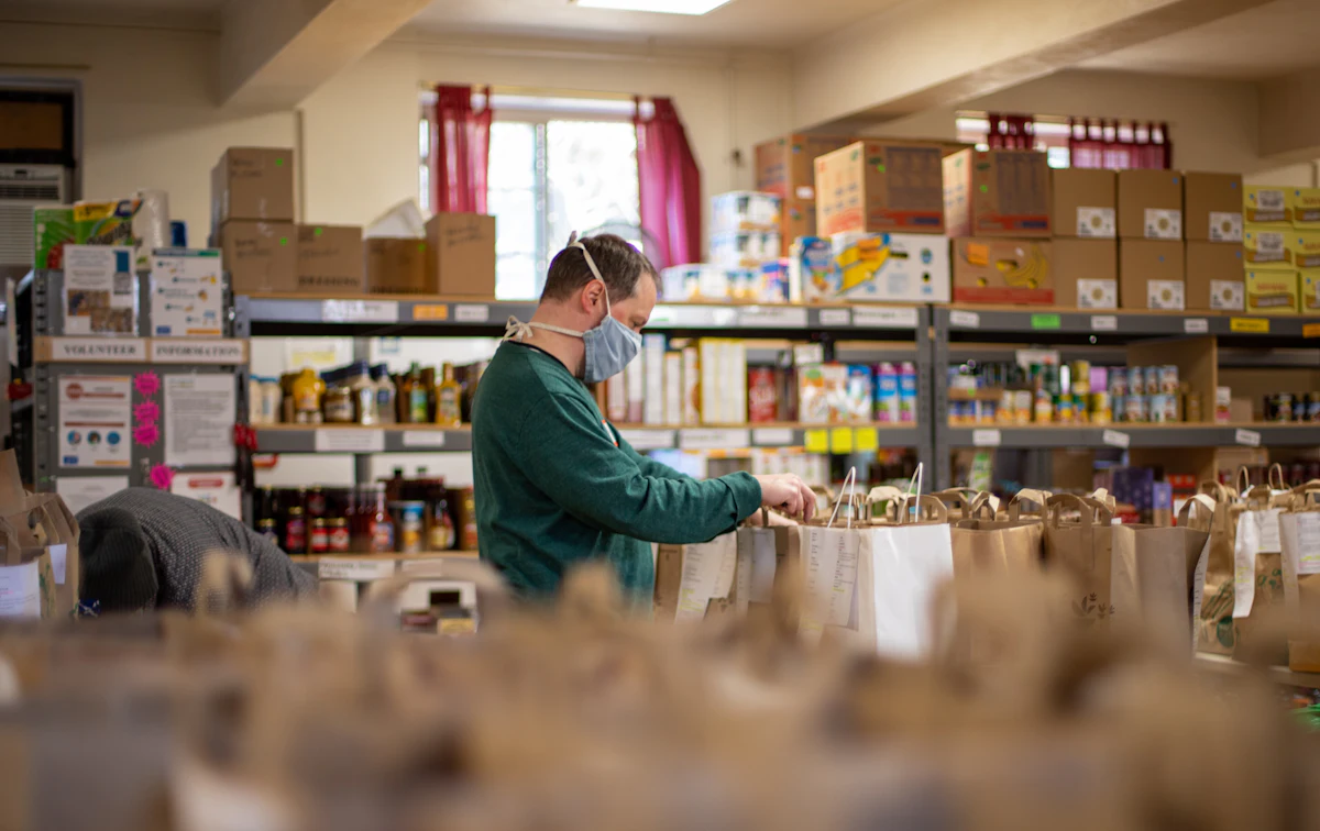 Volunteer stocking shelves at a client-choice food pantry