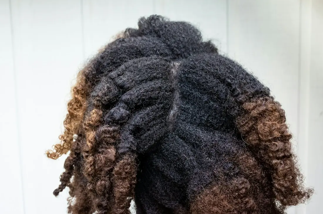 Defined natural curls with warm brown ends